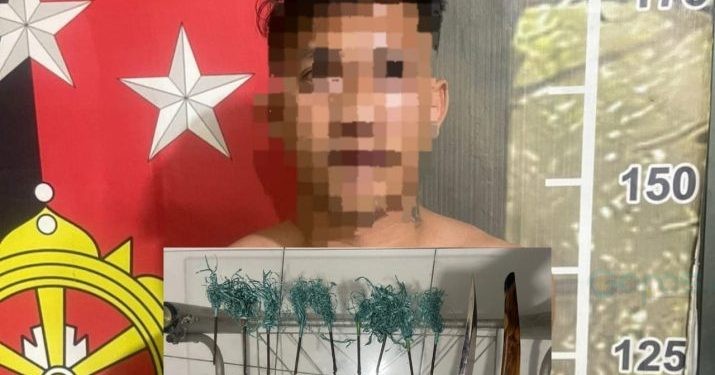 NK saat diamankan di Polresta Gorontalo Kota. (Foto Humas)