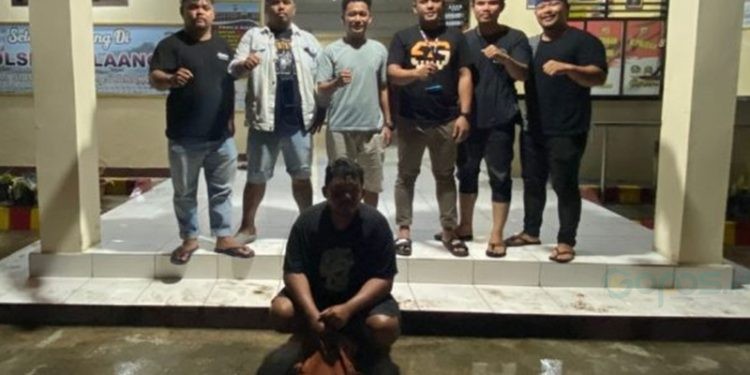 Tersangka penipuan FRM (28) saat diringkus Polda Gorontalo di Desa Ambang I, Kecamatan Bolaang Timur, Kabupaten Bolmong, Sulawesi Utara.(F. Polda Gtlo)