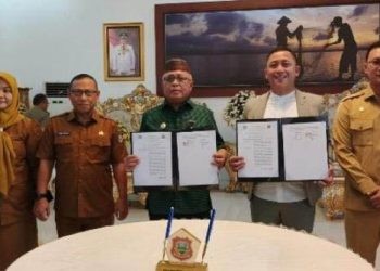 Penandatanganan Kerja Sama antara Pemkab Gorontalo dan BRI dalam rangka memaksimalkan transkasi nontunai di Pasar