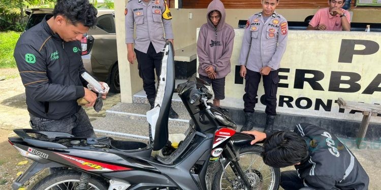 Pelaku saat di tangkap di perbatasan Molosipat, Minggu (15/06/2025) (Istimewa)