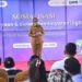 Wakil Bupati Gorontalo Utara Nurjana Hasan Yusuf, memberikan sambutan dalam sosialisasi pembiayaan dan sistem pembayaran digital yang dilaksanakan pada hari Senin (22/9/2025) di Taman Rakyat Desa Molingkapoto, Kecamatan Kwandang Gorontalo Utara.