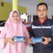Alex Yunianto menunjukkan lajayan JKN Mobile. (Foto: Dok/Humas BPJS Kesehatan Cabang Jember)