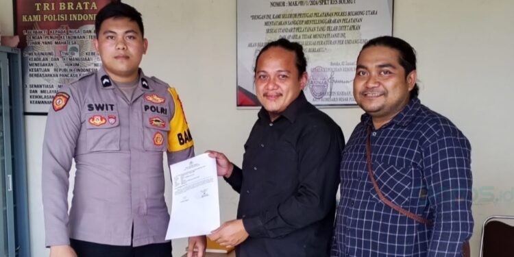 FP bersama Kuasa Hukumnya saat berada di SPKT Polres Boltara ( Dok: Istimewa)