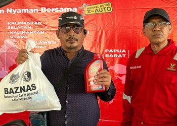 Ganti oli gratis kepada pengemudi bentor, ojek online di Kantor Baznas Kota Gorontalo pada 11 April 2026