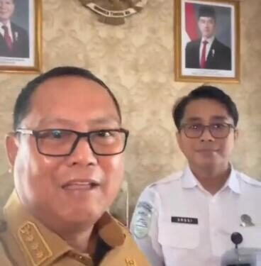 Bupati Gorontalo Utara Thariq Modanggu bersama Kepala Stasiun Geofisika Andri Wijaya Bidang.(F. Istimewa)
