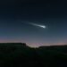 Fireball in the evening sky over the fields. Bright shooting star. Meteor illuminates the starry sky. (Ilustrasi)